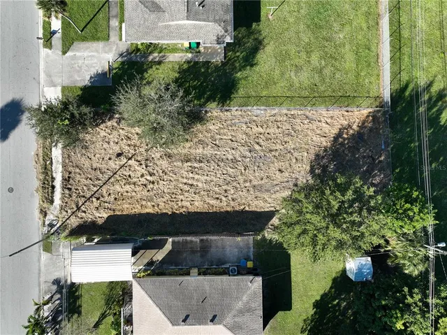 an aerial view of house with yard