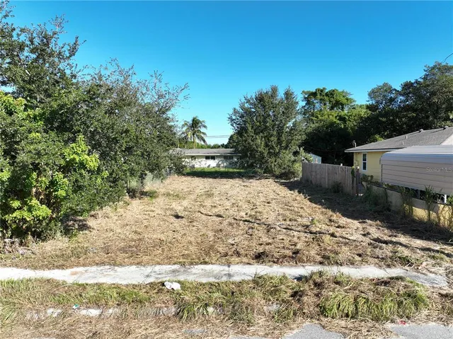 a view of a backyard of the house
