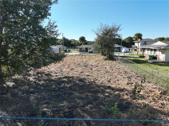 a pathway of a house with a yard