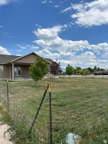 175 North 100th West Centerfield, UT 84622 - Photo 6 of 32 Expansive grassy lot featuring partial fencing.