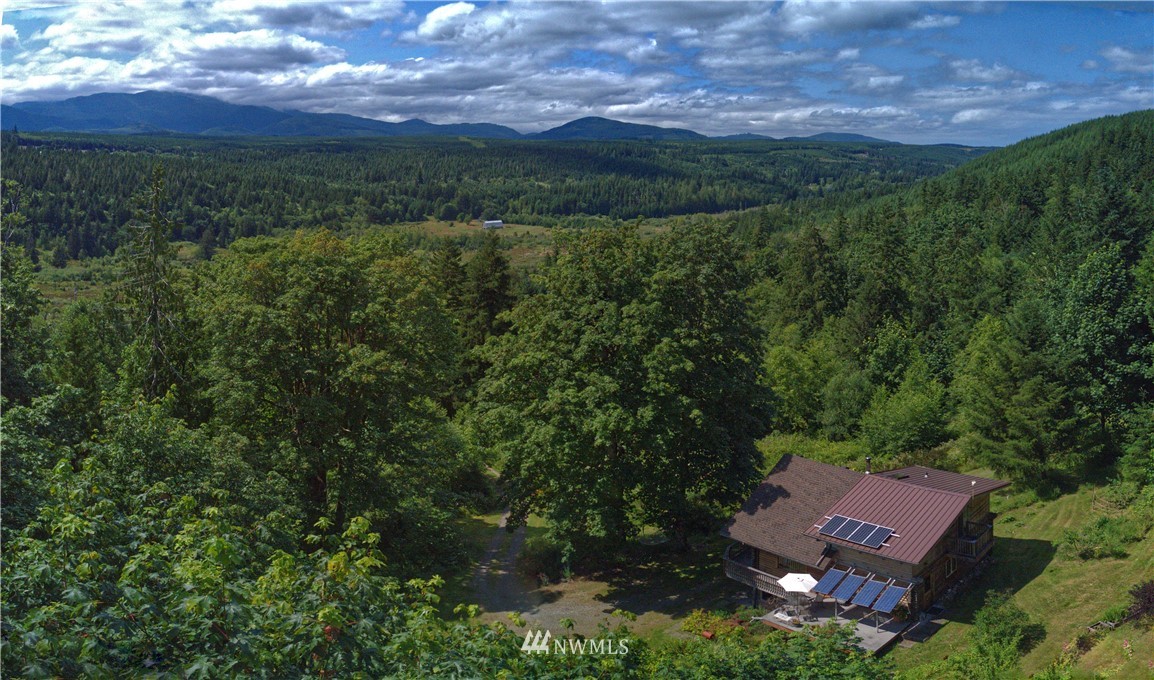 2707 Dabob Road Quilcene, WA 98376 - Photo 1 of 36 an aerial view of a house with a yard