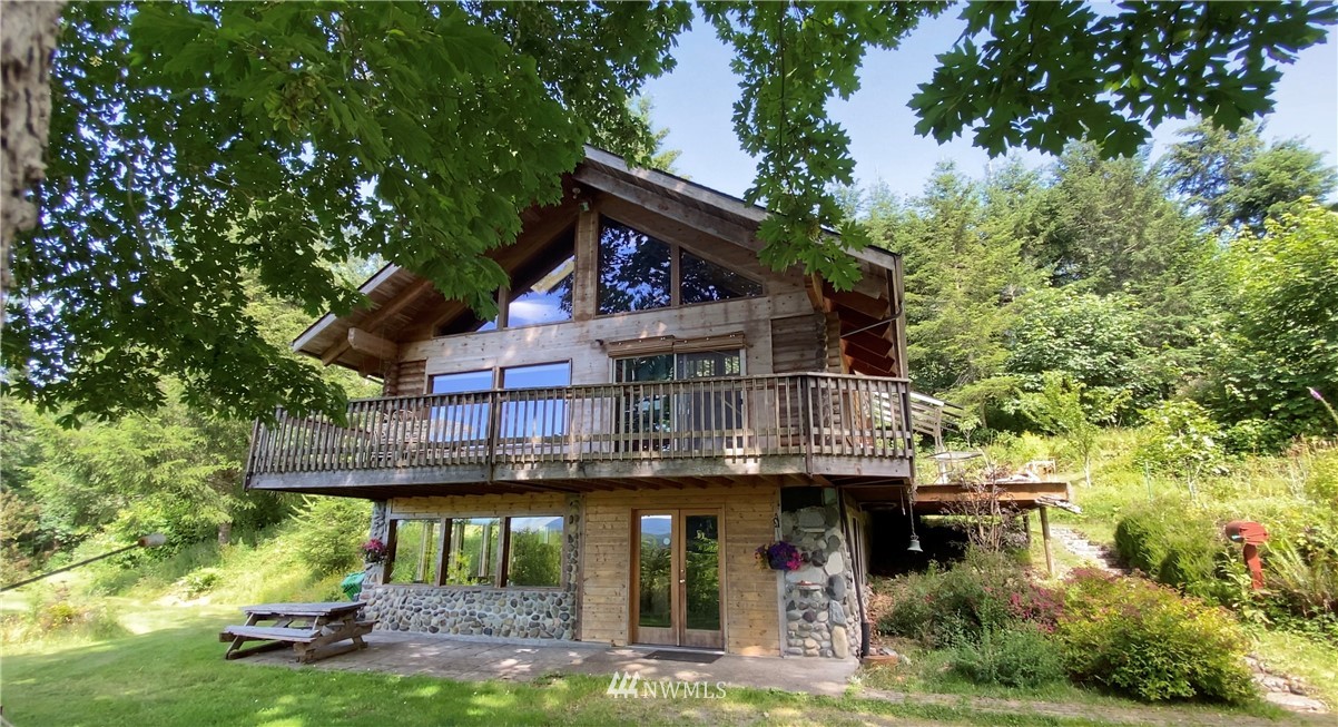 2707 Dabob Road Quilcene, WA 98376 - Photo 2 of 36 a view of house with a swimming pool
