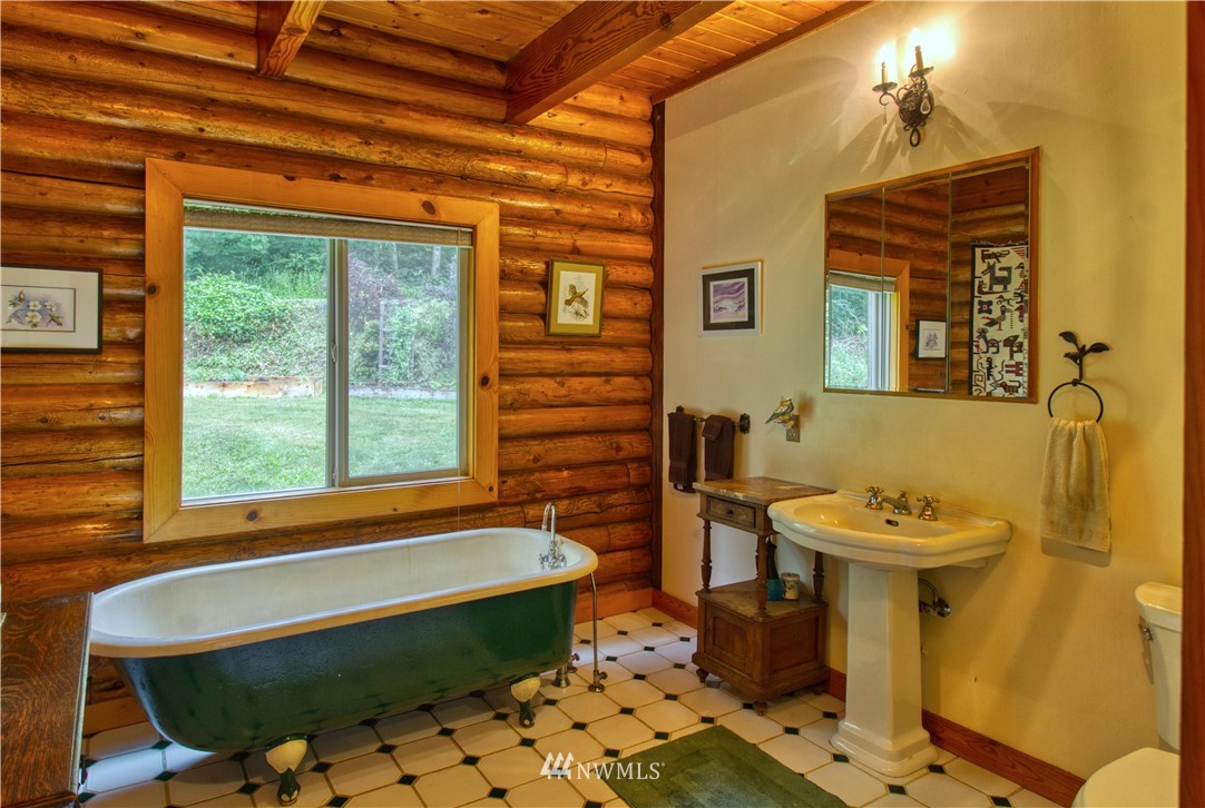 2707 Dabob Road Quilcene, WA 98376 - Photo 12 of 36 a bathroom with a sink a toilet and a bathtub