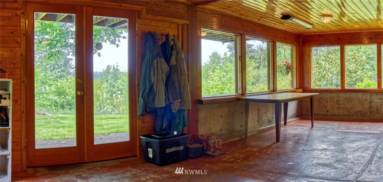 2707 Dabob Road Quilcene, WA 98376 - Photo 18 of 36 a living room with a large window
