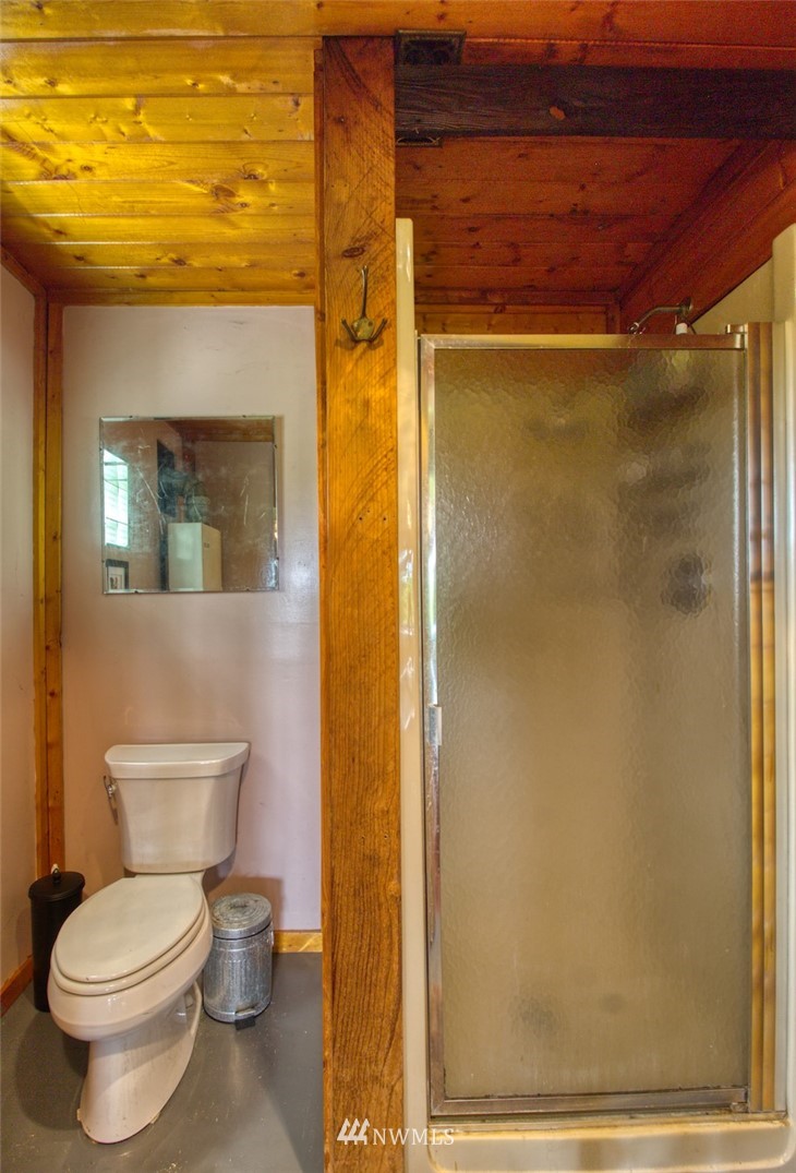 2707 Dabob Road Quilcene, WA 98376 - Photo 22 of 36 a bathroom with a toilet and a shower
