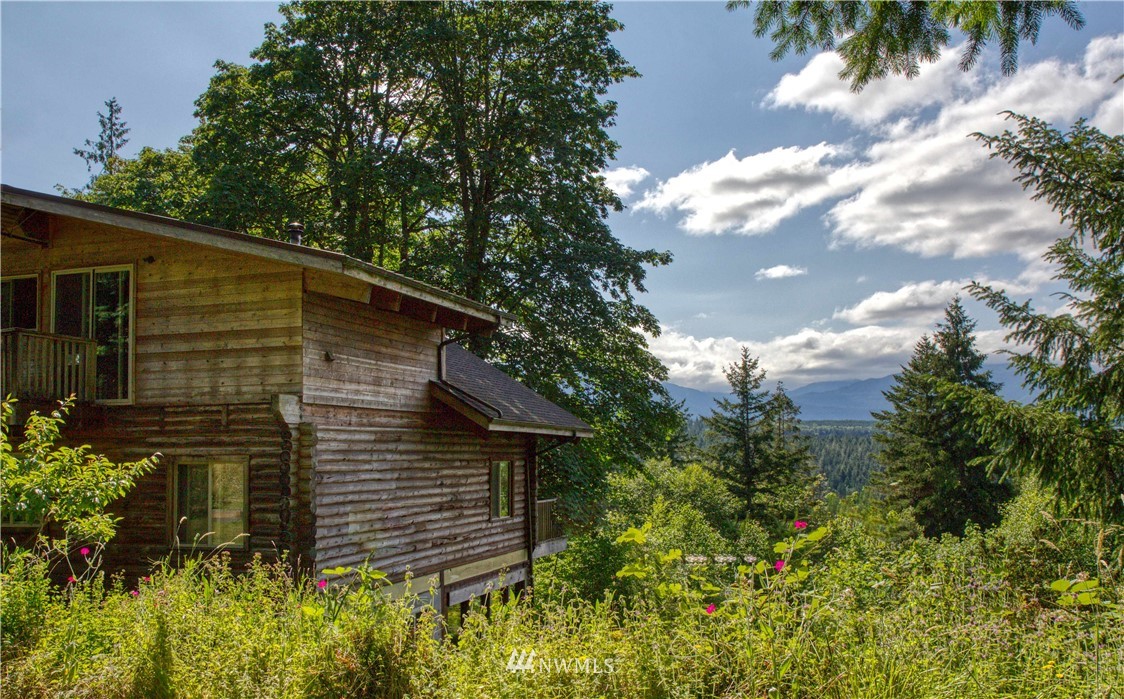 2707 Dabob Road Quilcene, WA 98376 - Photo 26 of 36 a backyard of a house with lots of green space