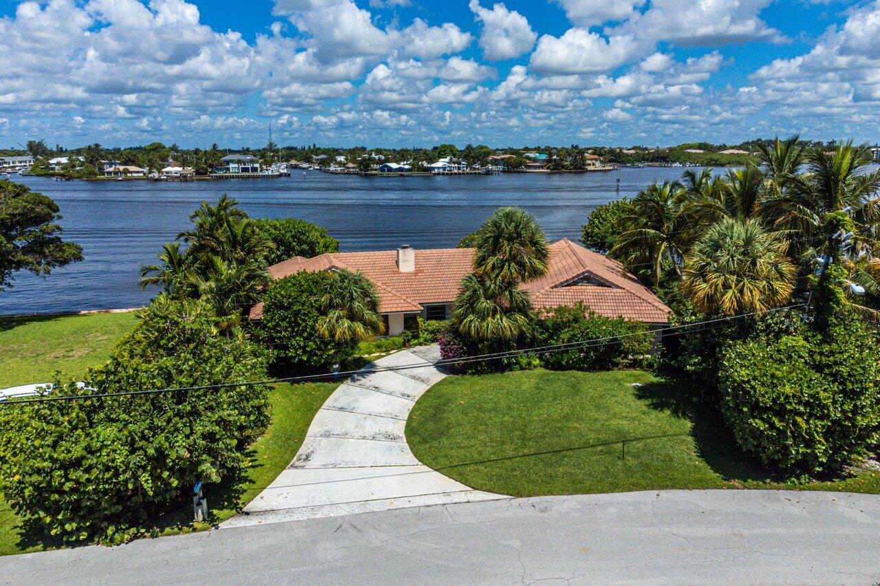 7 Sabal Island Drive Ocean Ridge, FL 33435 - Photo 12 of 44 an aerial view of a house with a yard and lake view