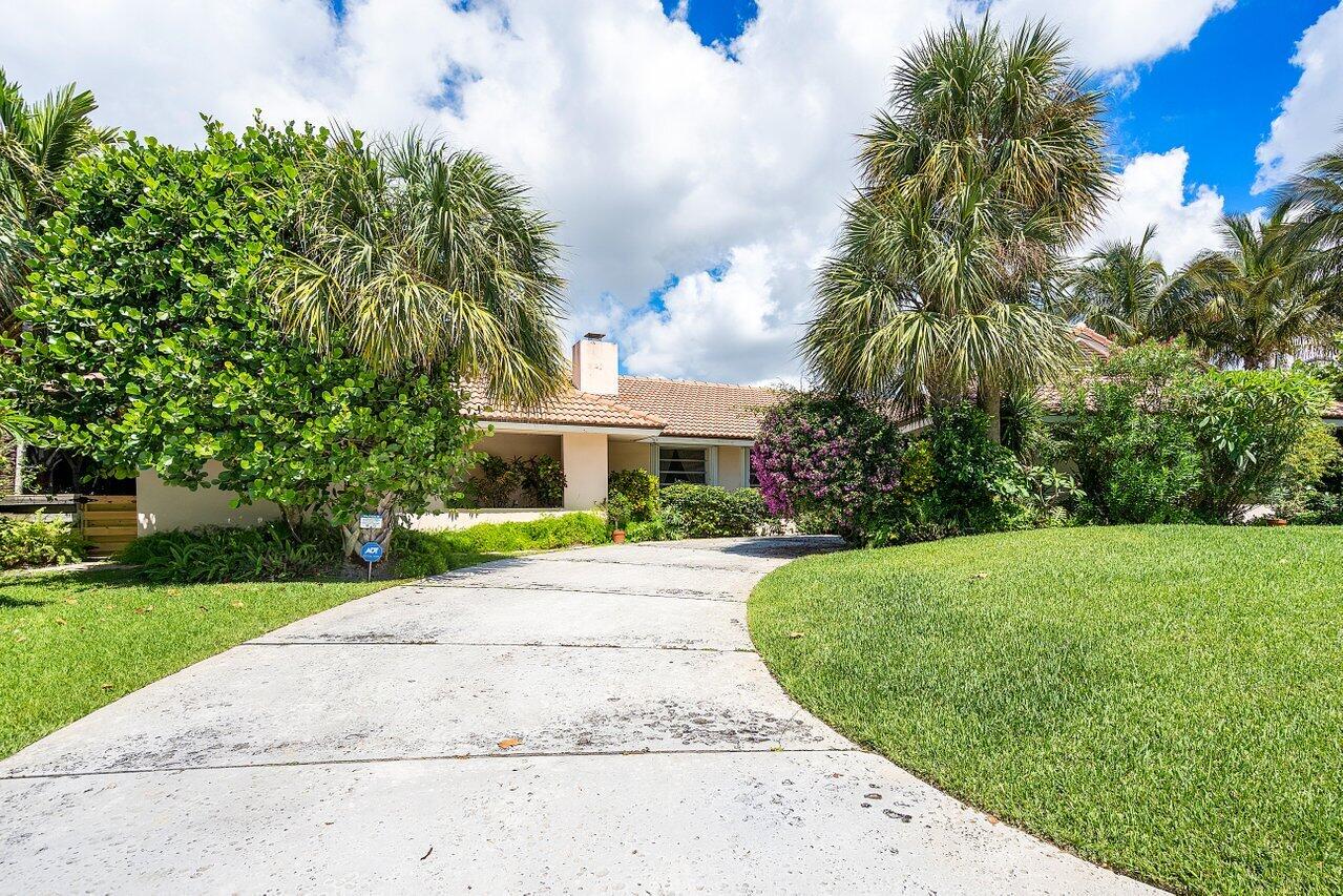 7 Sabal Island Drive Ocean Ridge, FL 33435 - Photo 13 of 44 a view of a patio with a garden