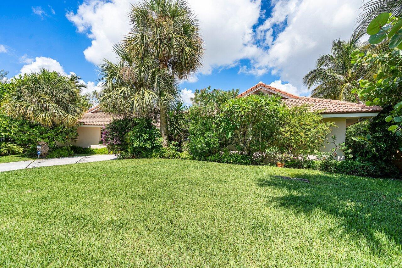 7 Sabal Island Drive Ocean Ridge, FL 33435 - Photo 15 of 44 a view of a garden with a fountain