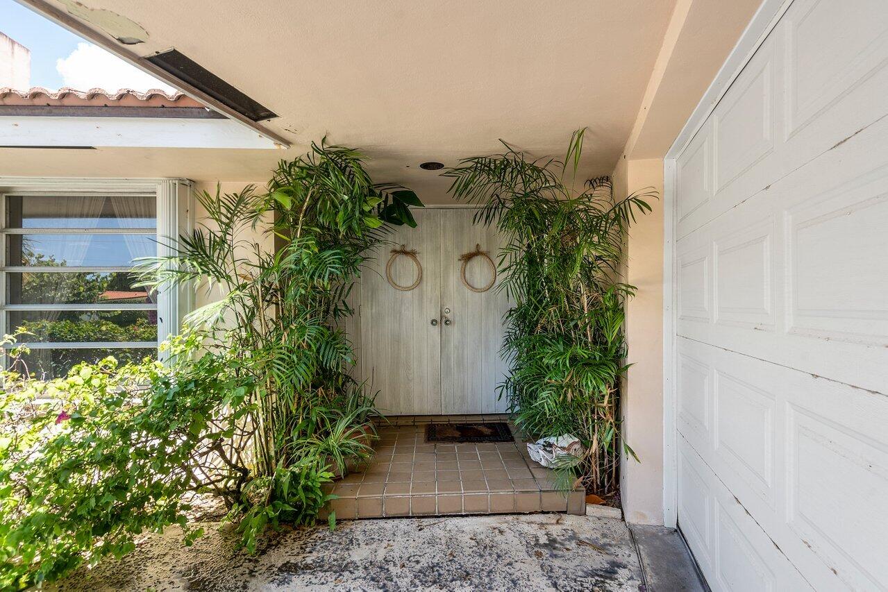 7 Sabal Island Drive Ocean Ridge, FL 33435 - Photo 17 of 44 a view of a house with a yard and plants