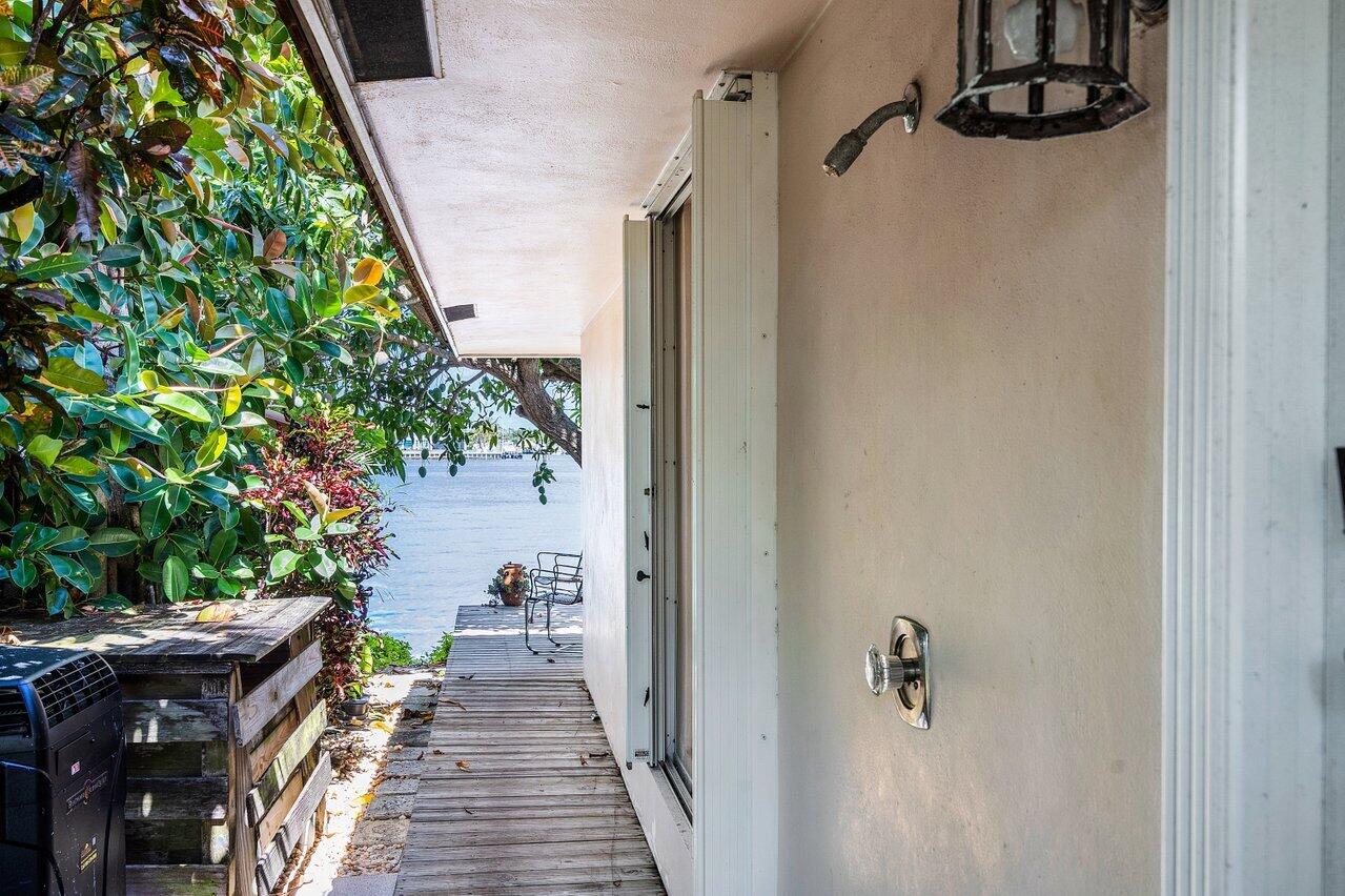 7 Sabal Island Drive Ocean Ridge, FL 33435 - Photo 19 of 44 a view of a pathway of a house