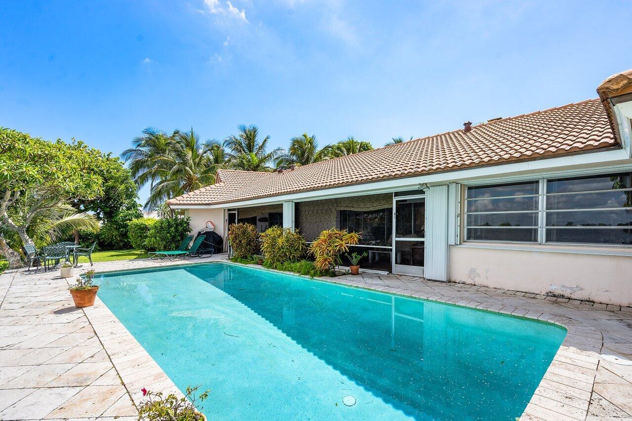 7 Sabal Island Drive Ocean Ridge, FL 33435 - Photo 20 of 44 a view of a house with a yard and sitting area