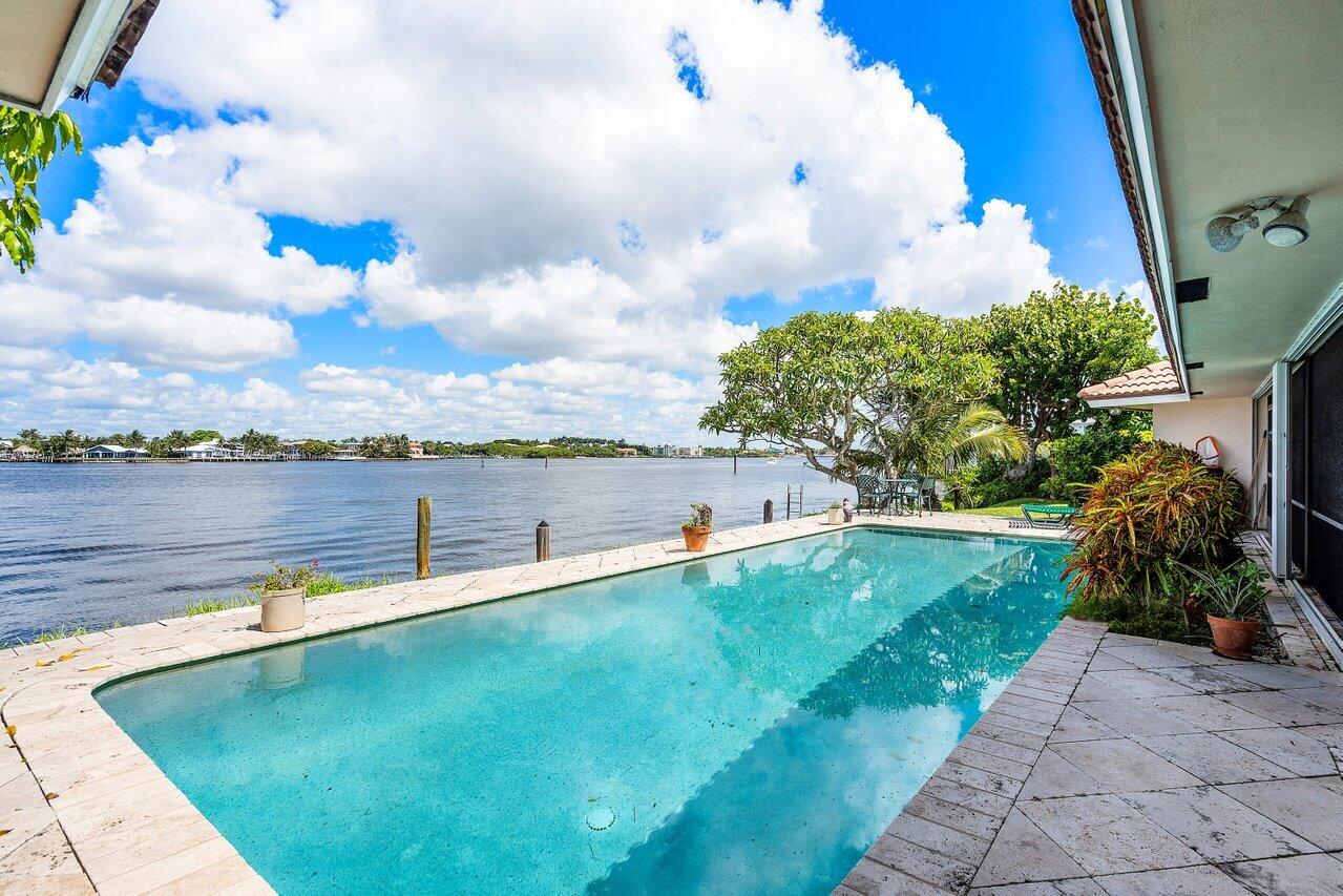 7 Sabal Island Drive Ocean Ridge, FL 33435 - Photo 21 of 44 a view of a lake with a big yard