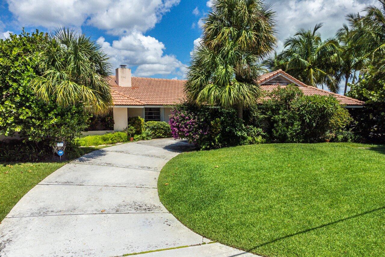 7 Sabal Island Drive Ocean Ridge, FL 33435 - Photo 23 of 44 front view of a house with a yard