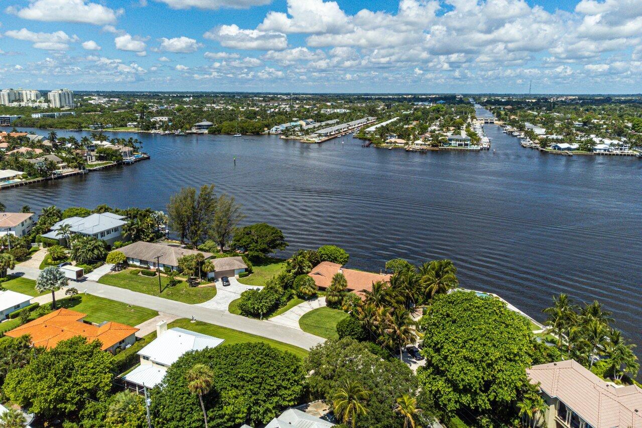 7 Sabal Island Drive Ocean Ridge, FL 33435 - Photo 25 of 44 a view of a lake with a city