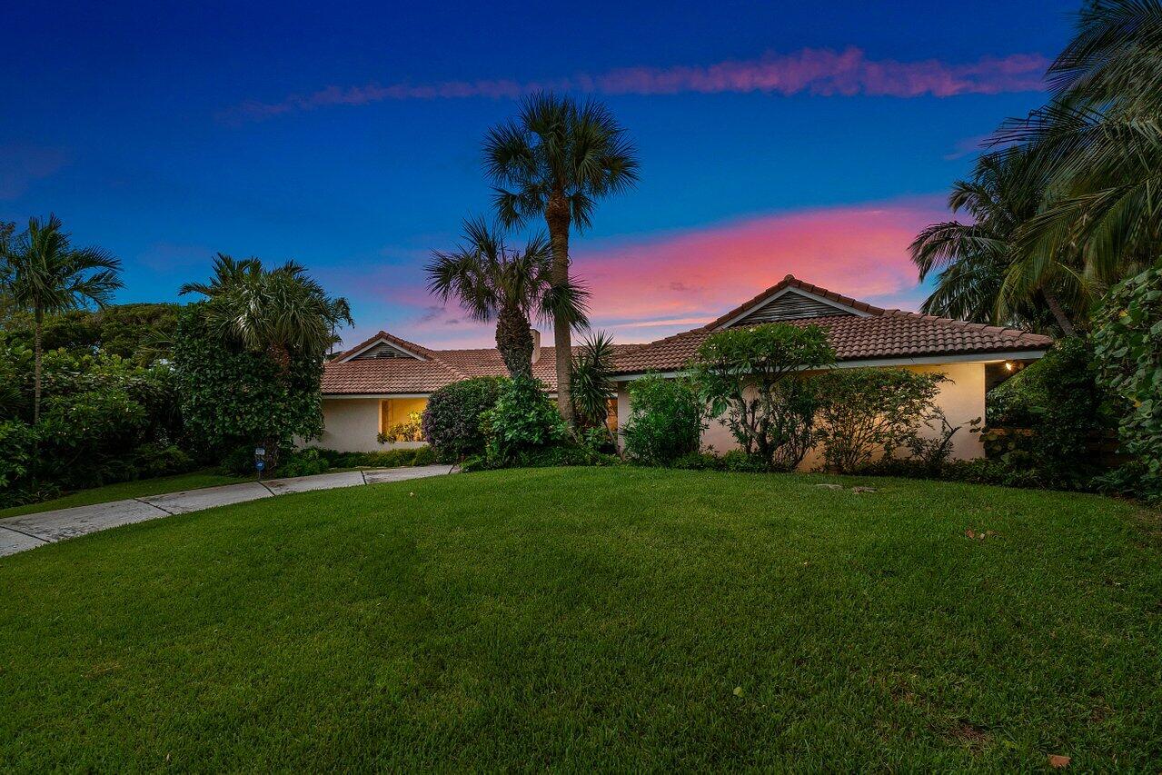7 Sabal Island Drive Ocean Ridge, FL 33435 - Photo 33 of 44 a front view of a house with garden