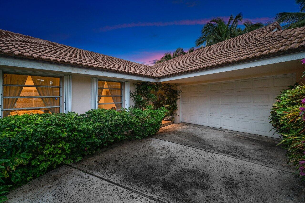 7 Sabal Island Drive Ocean Ridge, FL 33435 - Photo 34 of 44 a front view of a house with plants