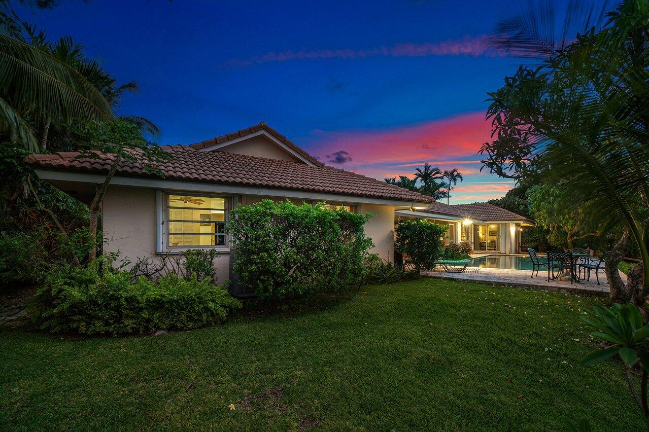 7 Sabal Island Drive Ocean Ridge, FL 33435 - Photo 36 of 44 a front view of a house with a yard