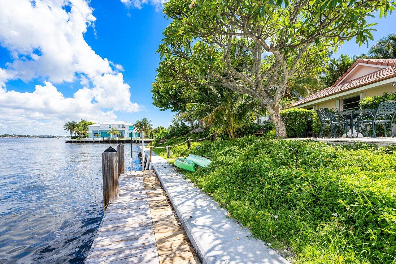 7 Sabal Island Drive Ocean Ridge, FL 33435 - Photo 5 of 44 a lake view with a garden