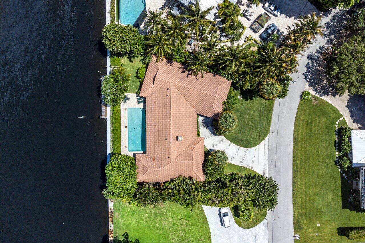 7 Sabal Island Drive Ocean Ridge, FL 33435 - Photo 9 of 44 an aerial view of a house with a yard and garden