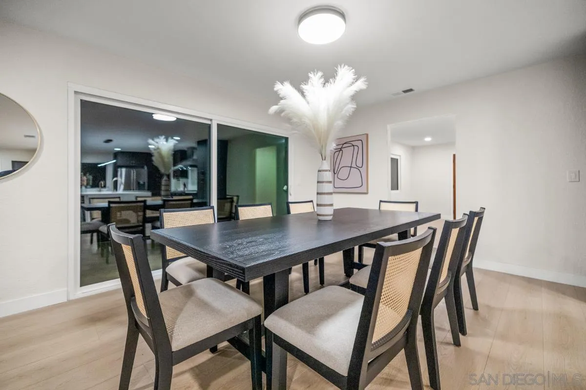 16206 Rostrata Hill Road Poway, CA 92064 - Photo 54 of 73 a dining room with a wooden table and chairs