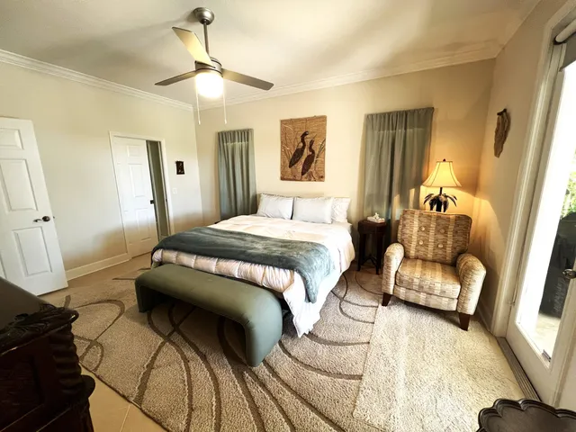 a bedroom with a bed and a couch