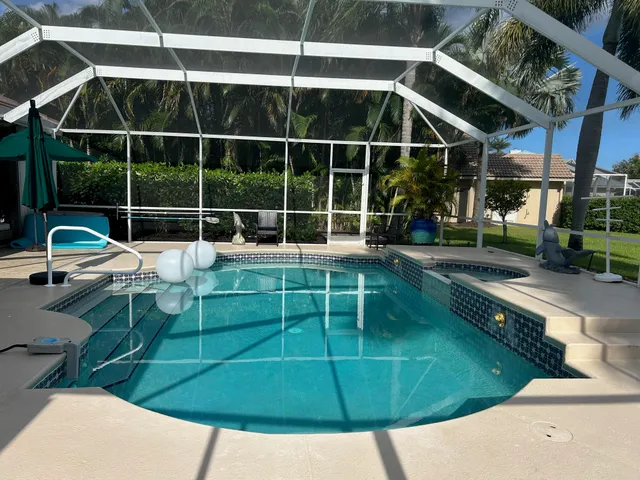 a wooden bench sitting in front of a building