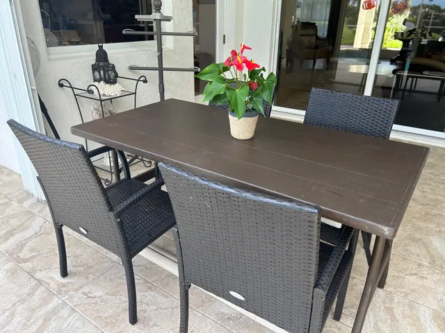 a kitchen with granite countertop a sink a stove and cabinets