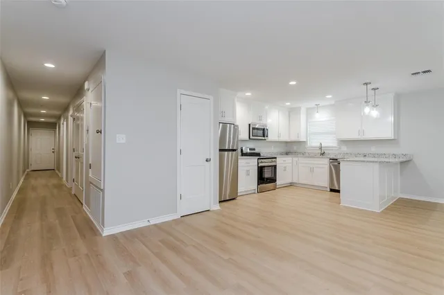 a view of kitchen with wooden floor