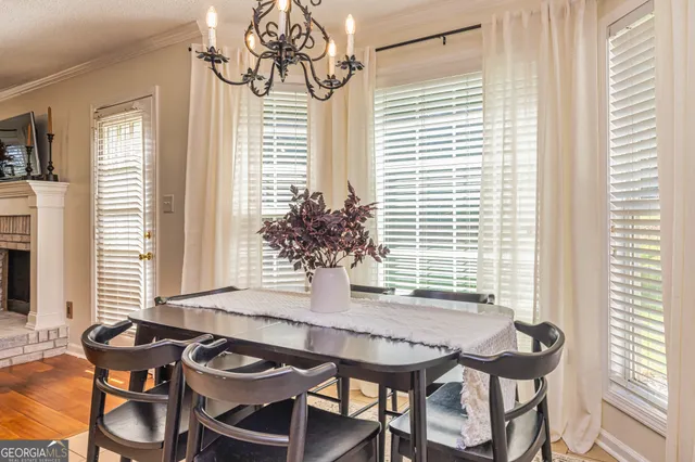 a view of a dining room with furniture and window