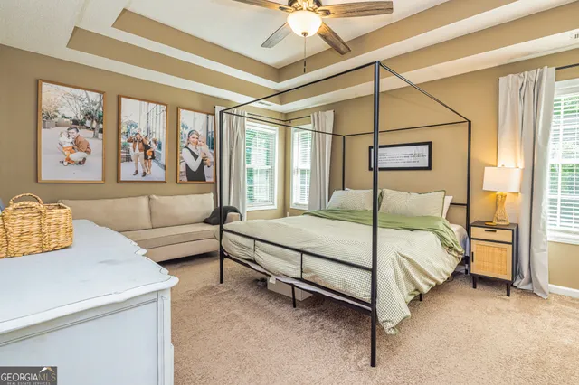 a bedroom with a bed and a couch