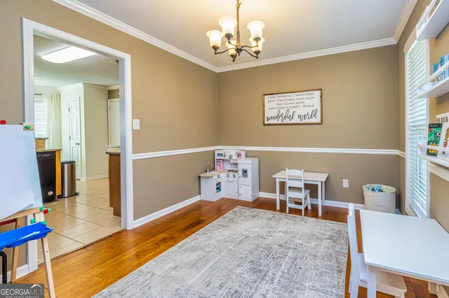 a bedroom with a bed and a table in it