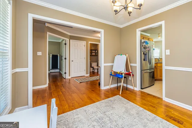 a view of a livingroom with furniture and wooden floor