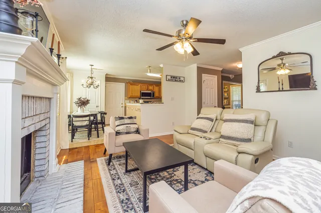 a living room with furniture and fireplace