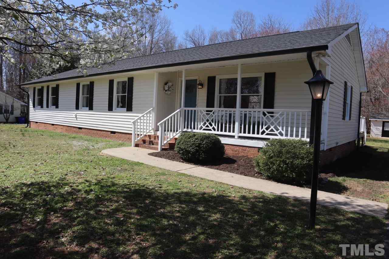 7009 Kiger Road Rougemont, NC 27572 - Photo 1 of 25 a front view of a house with a yard