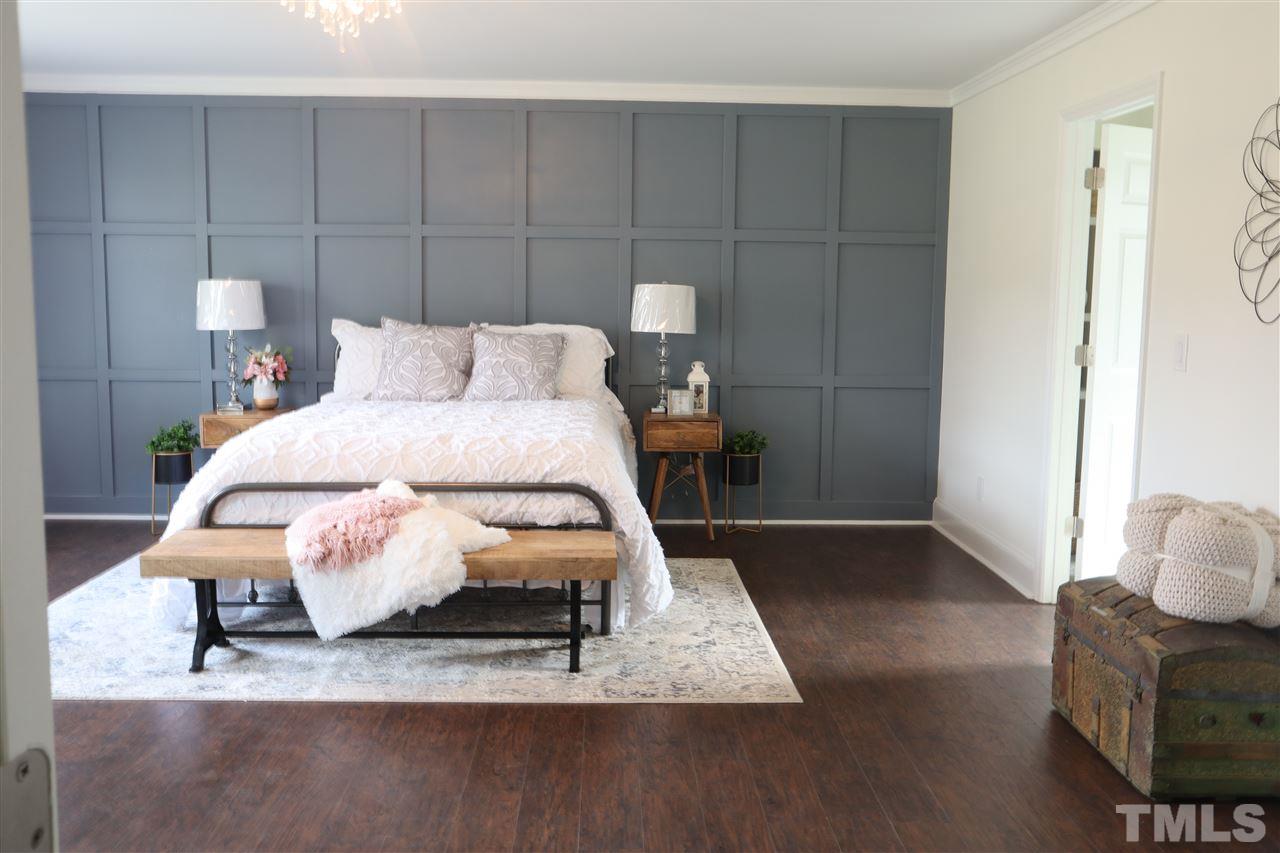 7009 Kiger Road Rougemont, NC 27572 - Photo 16 of 25 a bed room with a bed and a chair