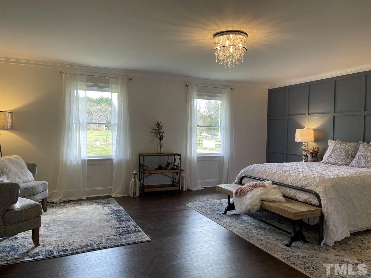 7009 Kiger Road Rougemont, NC 27572 - Photo 17 of 25 a spacious bedroom with a bed and a window