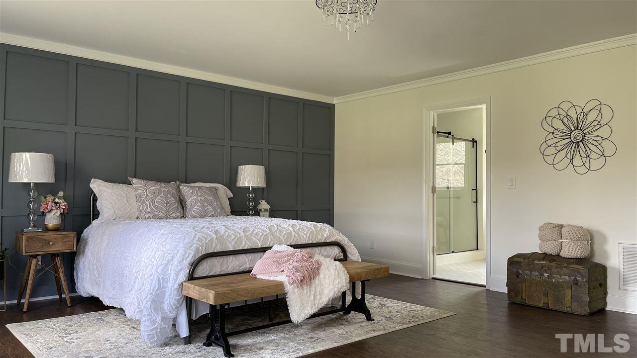 7009 Kiger Road Rougemont, NC 27572 - Photo 18 of 25 a bedroom with a bed and a couch