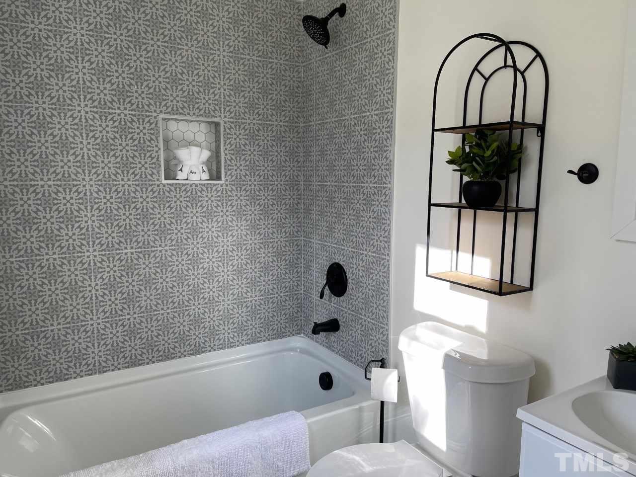 7009 Kiger Road Rougemont, NC 27572 - Photo 25 of 25 a bathroom with a toilet a sink and mirror