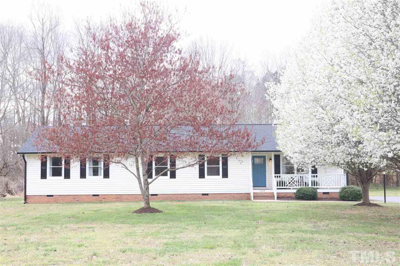 7009 Kiger Road Rougemont, NC 27572 - Photo 4 of 25 a front view of a house with a yard