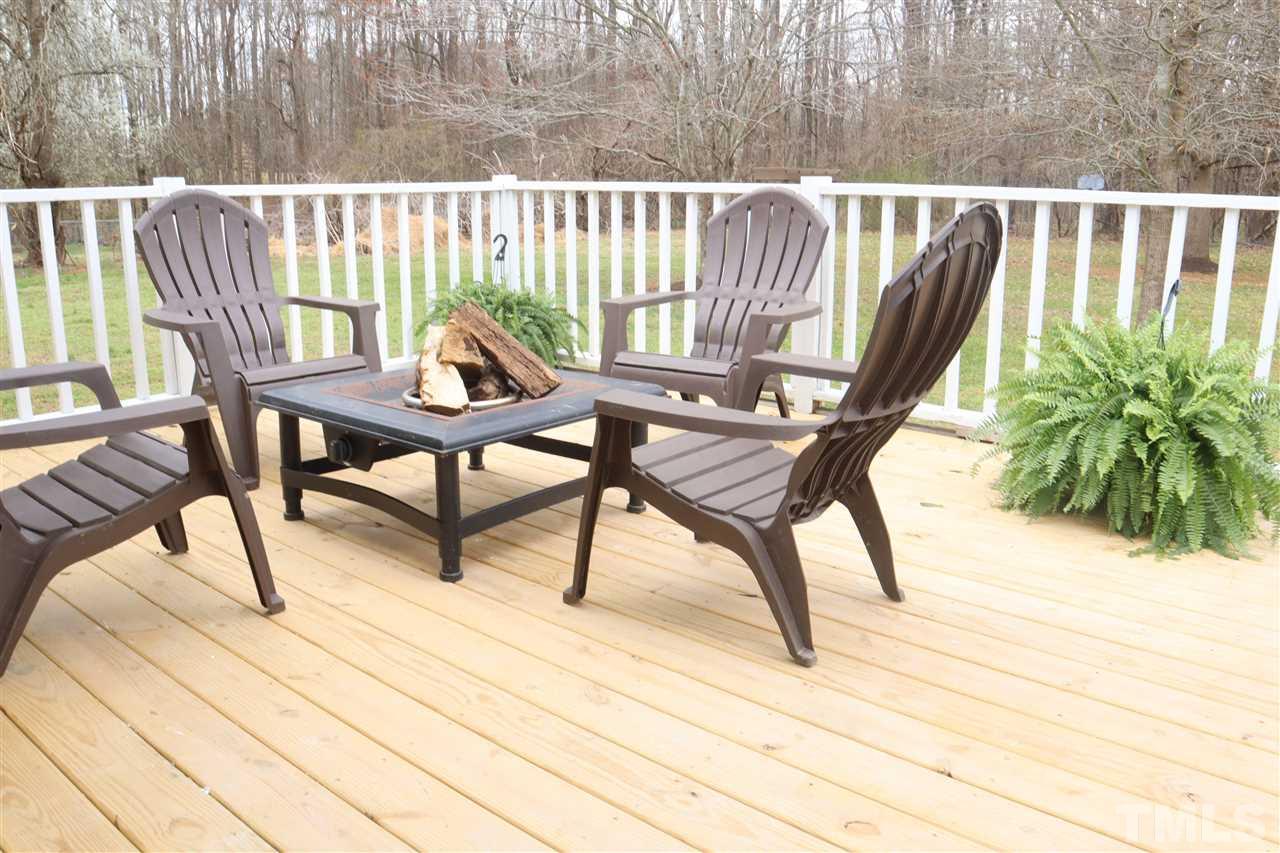 7009 Kiger Road Rougemont, NC 27572 - Photo 6 of 25 a view of a chairs and table in the patio