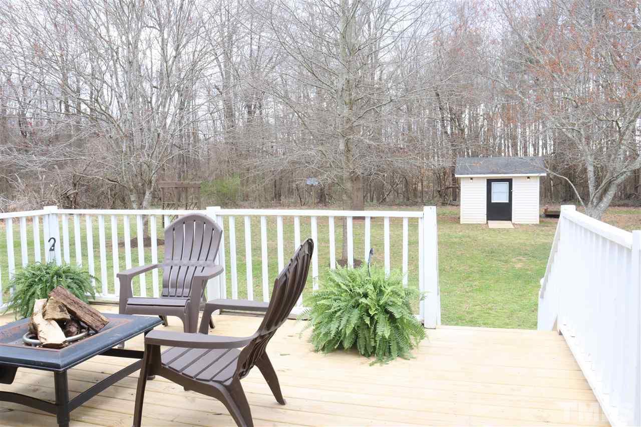 7009 Kiger Road Rougemont, NC 27572 - Photo 7 of 25 a balcony with with outdoor seating and plants
