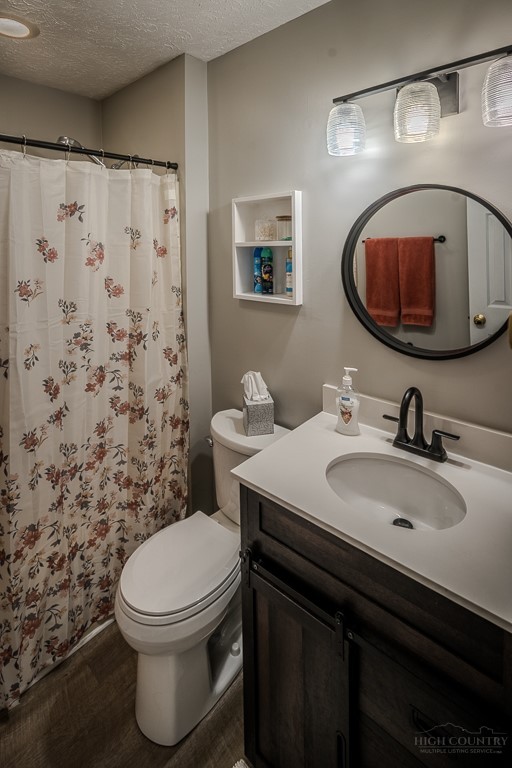 38 Rocky Meadows Road Newland, NC 28657 - Photo 25 of 50 a bathroom with a sink toilet and mirror