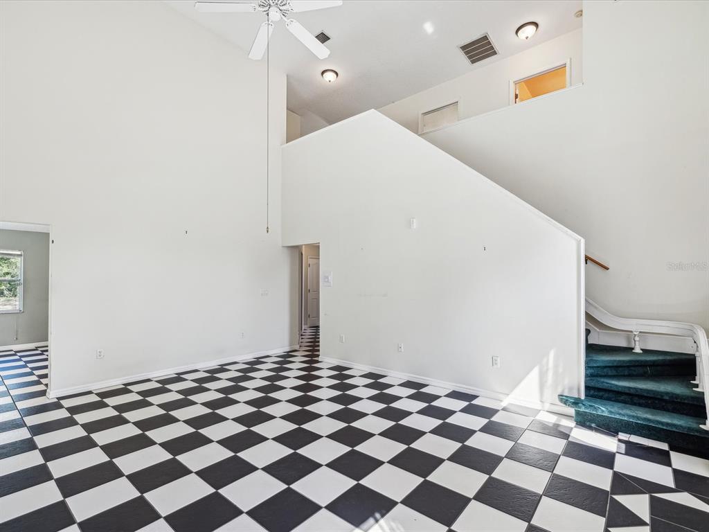 15420 Aubrey Avenue Spring Hill, FL 34610 - Photo 12 of 28 a black and white checkered floor