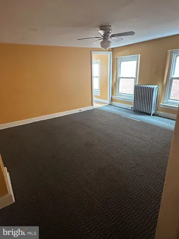 a view of empty room with windows