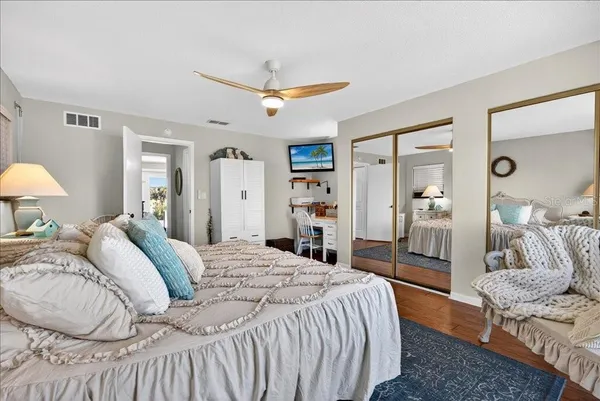 a bedroom with a bed and a dresser