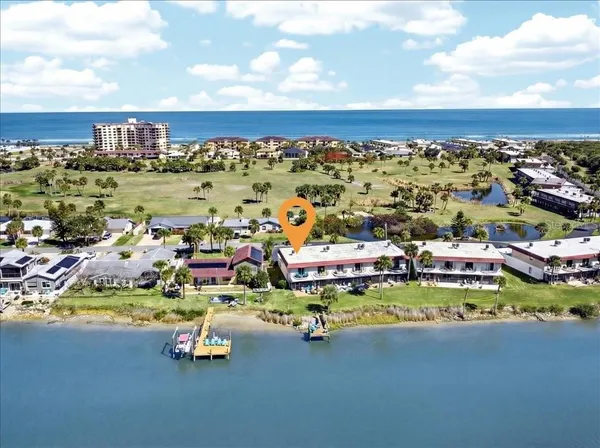 a view of a city with an ocean view