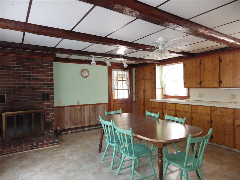 53 Chandler Road Belgrade, ME 04917 - Photo 23 of 34 Country kitchen with a wood stove.