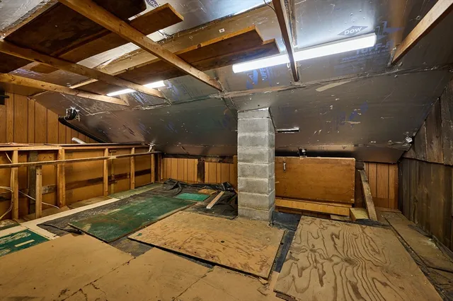 a view of a hall with wooden floor