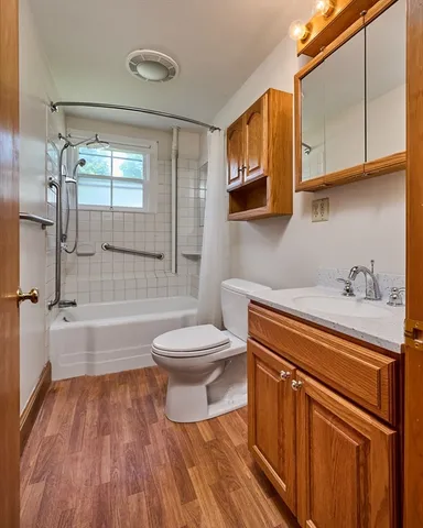 a bathroom with a sink a toilet and bathtub